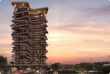 Modern high-rise residential building with wavy balconies at sunset.