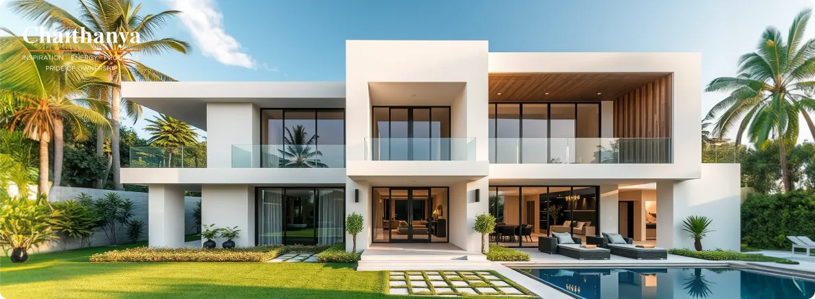 Modern two‑story white villa with glass balconies, expansive lawn, and a rectangular pool framed by palm trees.