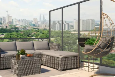 Patio with a gray wicker sectional sofa and coffee table, a hanging egg chair, and potted plants; city skyline and greenery in the background.