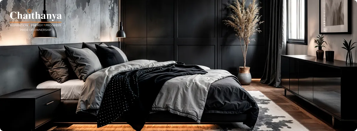 Modern bedroom interior with a low black bed, layered gray and black bedding, and dark paneled walls, plus warm under-bed lighting.
